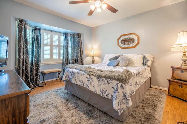 bedroom featuring ceiling fan and hardwood / wood-style floors