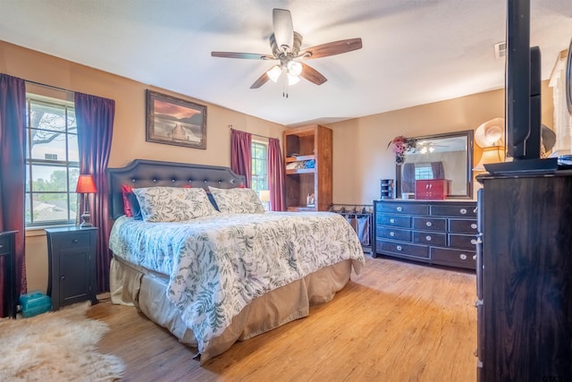 bedroom featuring ceiling fan and light hardwood / wood-style flooring