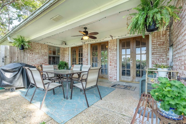 view of patio featuring ceiling fan, a grill, and french doors