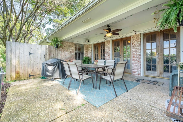 view of patio / terrace with ceiling fan, french doors, and area for grilling