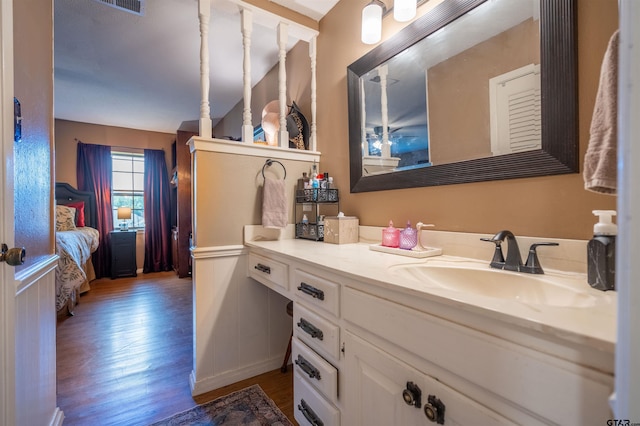 bathroom with vanity and wood-type flooring