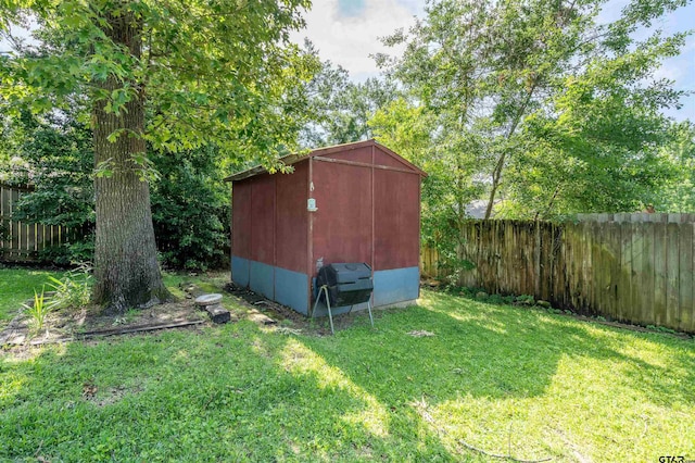 view of outbuilding featuring a lawn