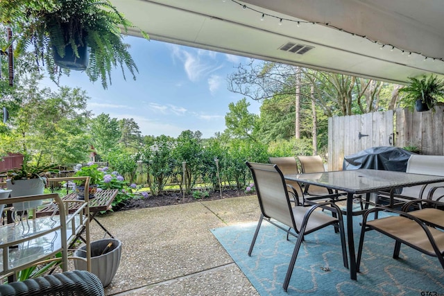 view of patio with a grill