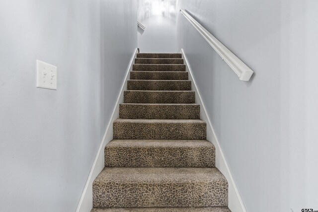 5201 Whitaker Cir, Longview, TX 75605 - stairway with baseboards