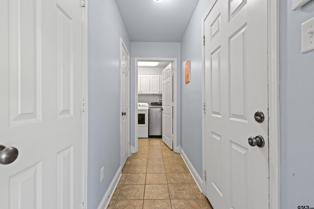 5201 Whitaker Cir, Longview, TX 75605 - hall featuring washer and dryer and light tile patterned flooring