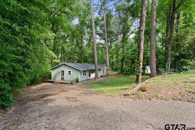 view of property exterior with a deck