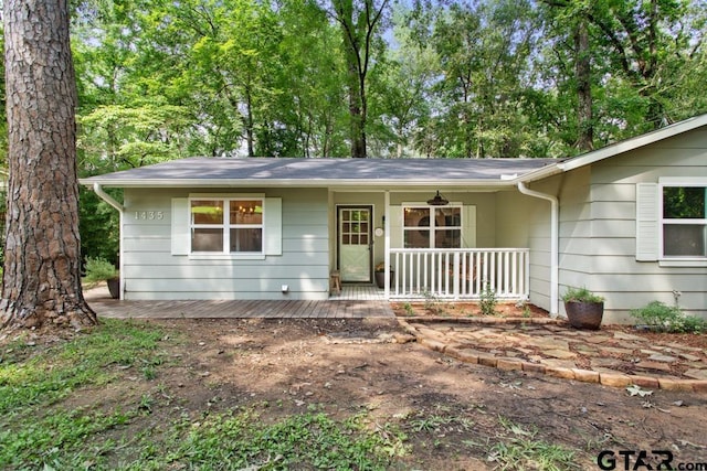 single story home featuring covered porch