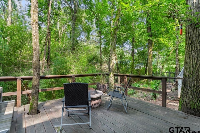 1435 W Hideaway Ln, Hideaway, TX 75771 - wooden deck featuring a fire pit