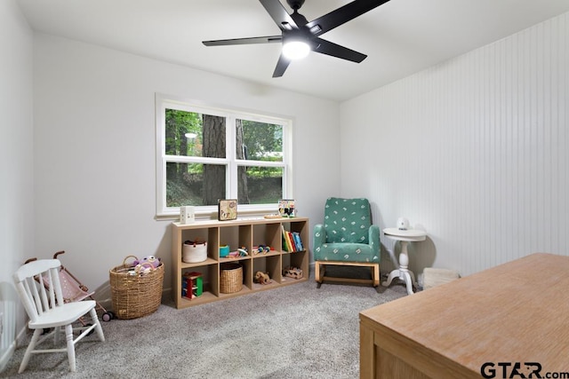 interior space with carpet and ceiling fan