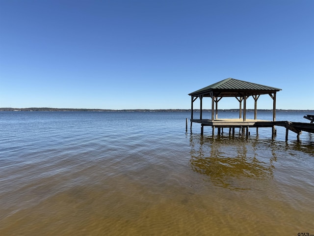 dock area featuring a gazebo and a water view