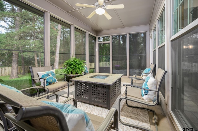 17889 County Road 134, Flint, TX 75762 - sunroom / solarium featuring ceiling fan and an outdoor living space with a fire pit