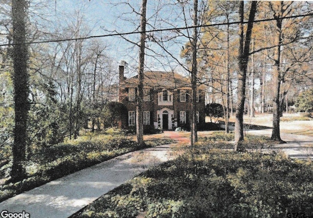 view of front of home with a chimney