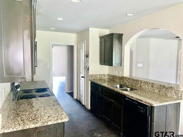 kitchen featuring dishwasher, stainless steel range, sink, and light stone counters