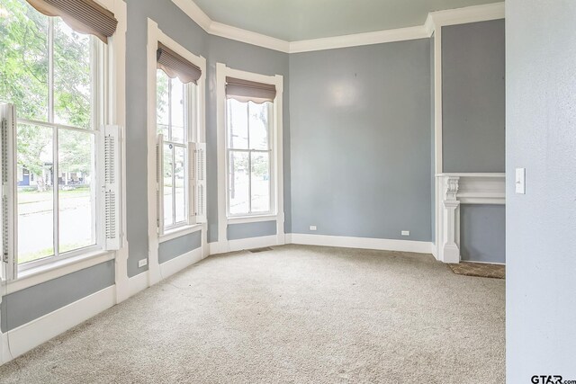293 S Barron, Rusk, TX 75785 - carpeted empty room featuring crown molding and baseboards