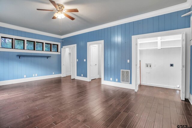 293 S Barron, Rusk, TX 75785 - unfurnished living room with ceiling fan, ornamental molding, dark wood-style flooring, and wood walls