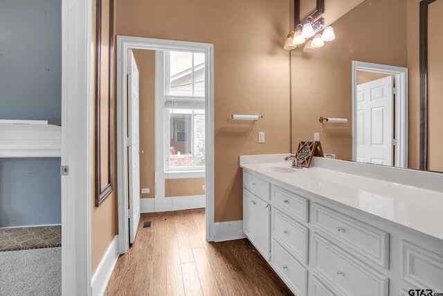 293 S Barron, Rusk, TX 75785 - bathroom featuring wood finished floors and vanity