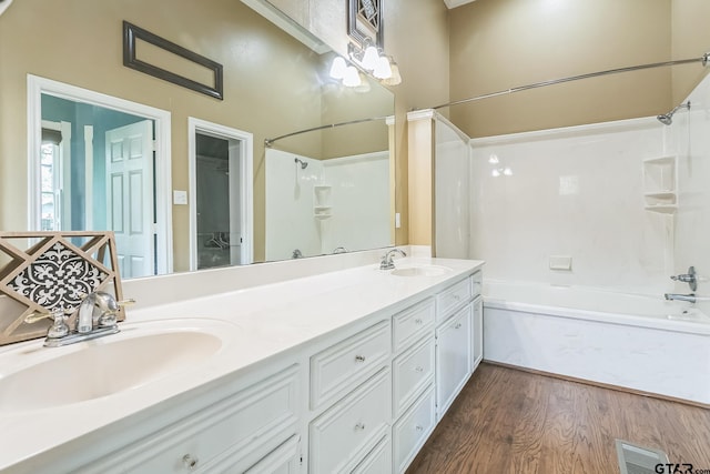 293 S Barron, Rusk, TX 75785 - full bath featuring tub / shower combination, double vanity, and wood finished floors