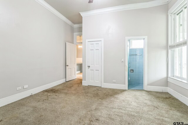 293 S Barron, Rusk, TX 75785 - unfurnished bedroom featuring carpet flooring, crown molding, and connected bathroom
