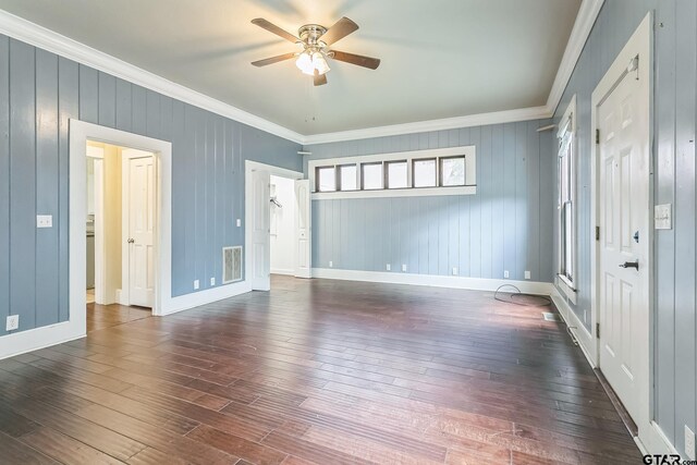 293 S Barron, Rusk, TX 75785 - unfurnished room featuring ornamental molding, ceiling fan, and dark wood-type flooring