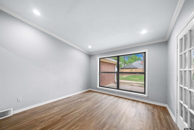 1261 Luann Ln, Tyler, TX 75703 - bedroom featuring baseboards, visible vents, a ceiling fan, and wood finished floors