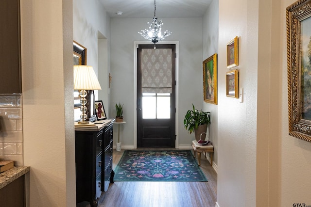 1420 Allison Ln, Lindale, TX 75771 - entryway featuring wood finished floors, a chandelier, and baseboards