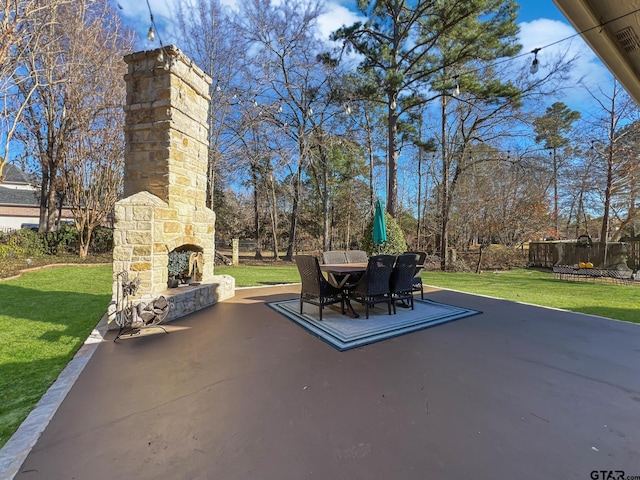 view of patio / terrace with an outdoor stone fireplace