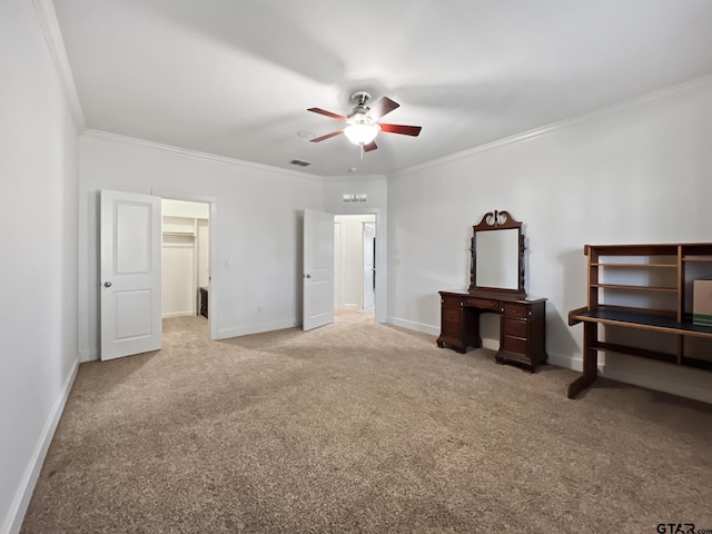 bedroom featuring ceiling fan, ornamental molding, a spacious closet, and a closet