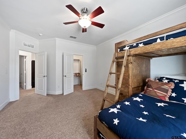 carpeted bedroom featuring crown molding and ceiling fan