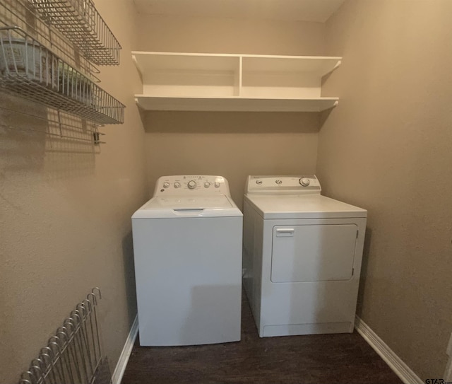 5848 Grace Ave, Tyler, TX 75707 - laundry area with washing machine and clothes dryer, radiator heating unit, baseboards, and dark wood-style flooring