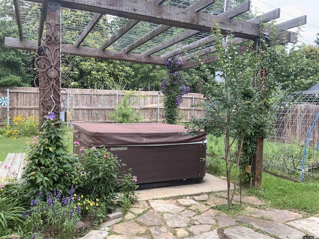 5848 Grace Ave, Tyler, TX 75707 - view of patio featuring a hot tub, fence, and a pergola