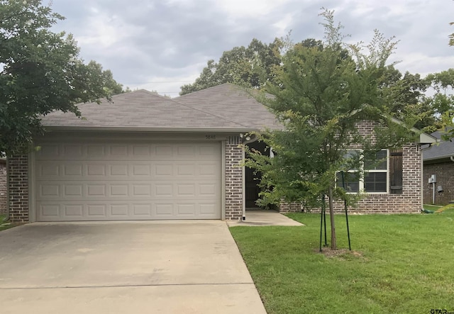 5848 Grace Ave, Tyler, TX 75707 - garage featuring concrete driveway
