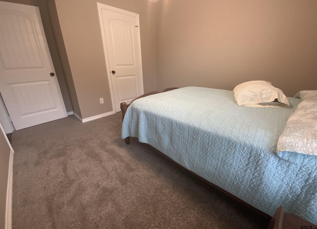 5848 Grace Ave, Tyler, TX 75707 - bedroom with dark colored carpet and baseboards