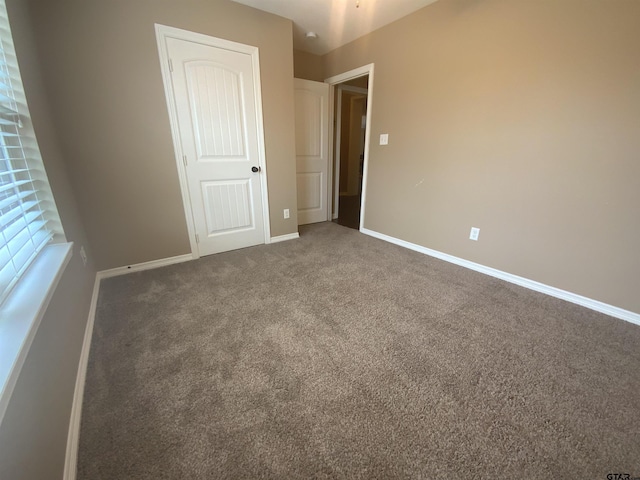5848 Grace Ave, Tyler, TX 75707 - unfurnished bedroom with carpet and baseboards