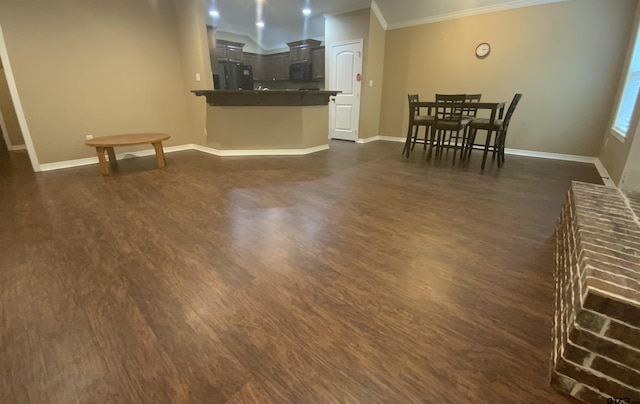 5848 Grace Ave, Tyler, TX 75707 - living room featuring dark wood finished floors, crown molding, and baseboards