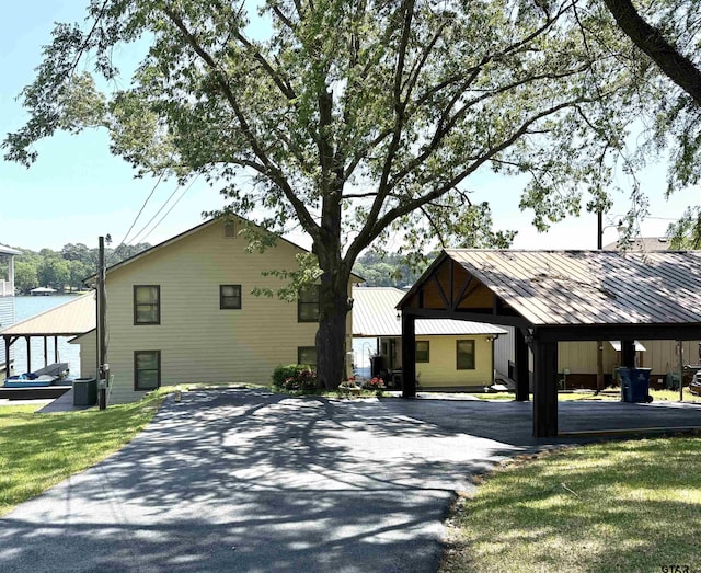 view of side of home with a yard and cooling unit