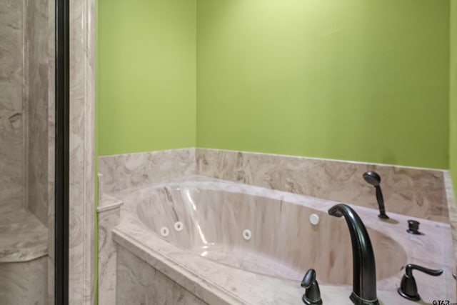 bathroom with a whirlpool tub