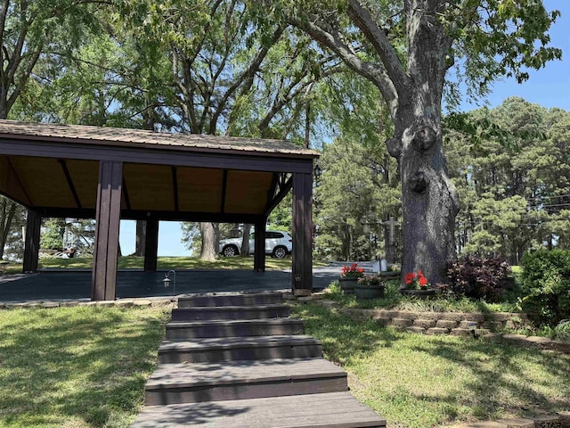 view of property's community with a lawn