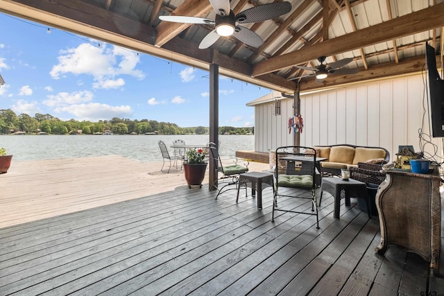 wooden deck featuring ceiling fan and an outdoor hangout area