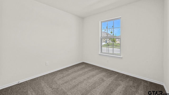 490 Burnett Trl, Canton, TX 75103 - spare room featuring dark colored carpet and baseboards