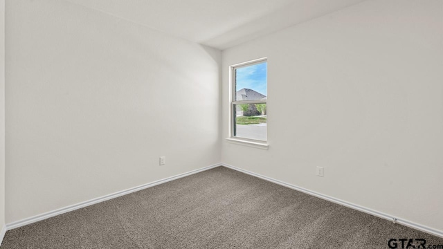 490 Burnett Trl, Canton, TX 75103 - spare room with dark colored carpet and baseboards