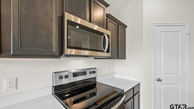 490 Burnett Trl, Canton, TX 75103 - kitchen featuring appliances with stainless steel finishes, dark brown cabinets, and light countertops