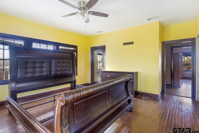 bedroom with ceiling fan and hardwood / wood-style flooring