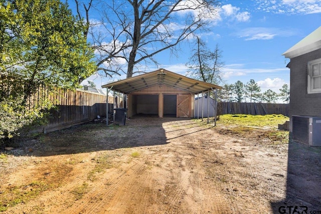 exterior space with a carport and central AC unit