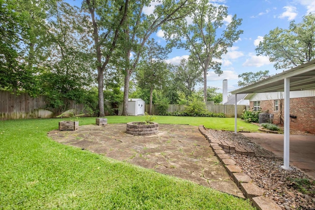 3316 S Cameron Ave, Tyler, TX 75701 - fenced backyard with a shed, a patio, and an outdoor fire pit