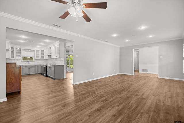 3316 S Cameron Ave, Tyler, TX 75701 - unfurnished living room with a ceiling fan, recessed lighting, wood finished floors, and ornamental molding