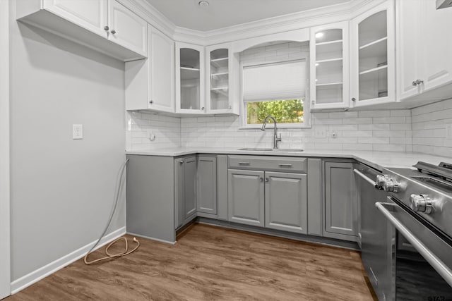 3316 S Cameron Ave, Tyler, TX 75701 - kitchen featuring electric range, gray cabinets, glass insert cabinets, tasteful backsplash, and light countertops