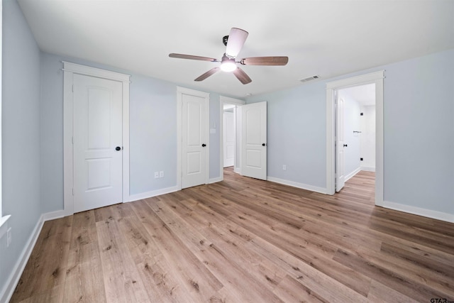 unfurnished bedroom featuring light hardwood / wood-style flooring and ceiling fan