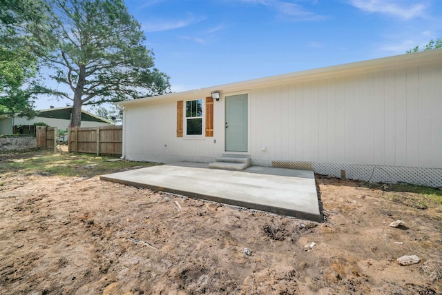 back of house with a patio area