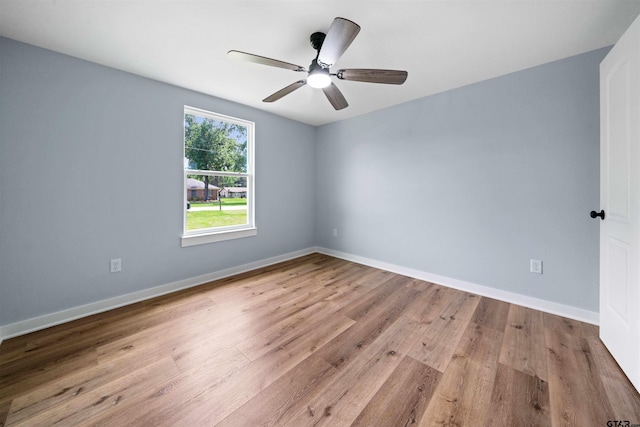 unfurnished room with light hardwood / wood-style flooring and ceiling fan