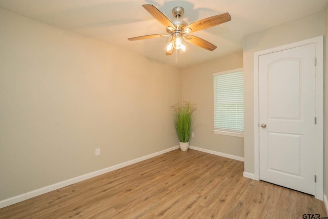 1021 N Montgomery St, Gilmer, TX 75644 - empty room with light wood-type flooring and ceiling fan